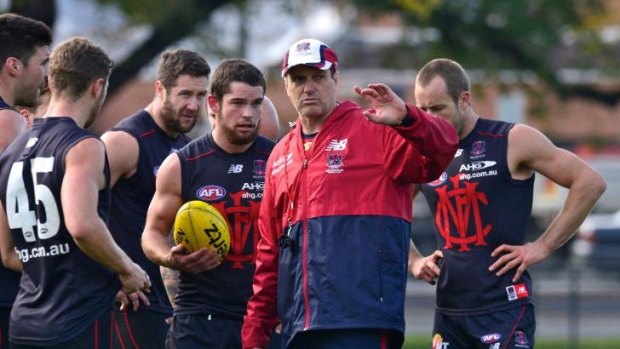 Undecided: Paul Roos with his players.