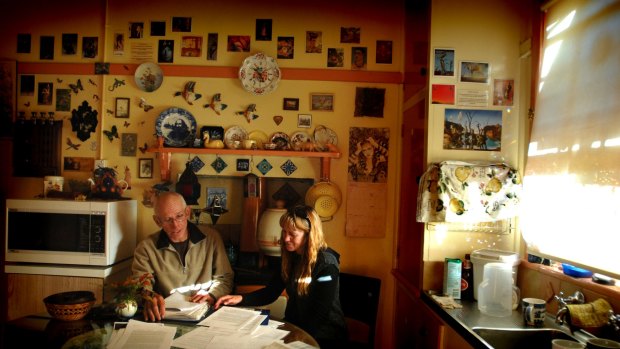 Peter and Jenni Farrell in 2008 in the kitchen of the Stromlo Cottage before they were evicted by the ACT Government to make way for the Molonglo housing development. 