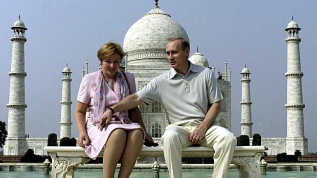 Russian President Vladimir Putin and his wife Lyudmila sit in front of the Taj Mahal while touring the city of Agra in 2000.
