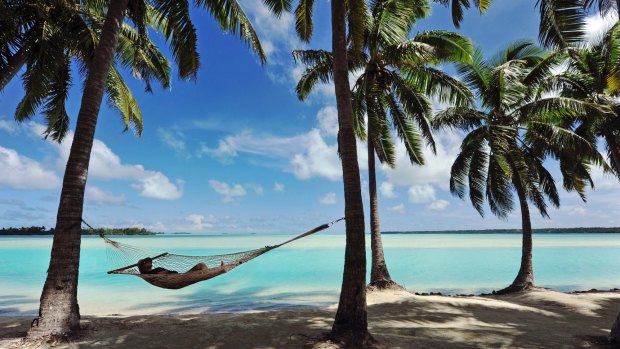 Relaxing by Aitutaki Lagoon in the Cook Islands.