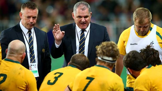 Wallabies coach Ewen McKenzie with the team during the final Bledisloe game against New Zealand on Saturday.