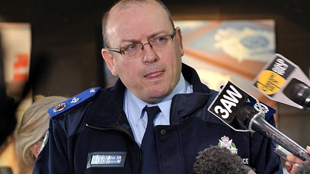 Questions ... Deputy Commissioner Graham Ashton addresses a press conference today.