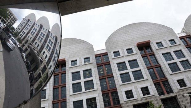 The US Courthouse in Washington, where the secret Foreign Intelligence Surveillance Court resides, is seen in a parking garage safety mirror at left.