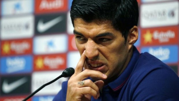 Luis Suarez talks to the media in Barcelona on Tuesday.