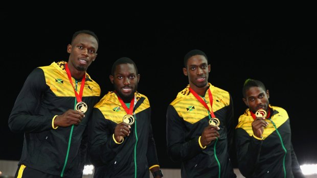 Champions: Usain Bolt, Nickel Ashmeade Kemar Bailey-Cole and Jason Livermore of Jamaica pose on the podium during the medal ceremony for the Men's 4x100 metres relay at the Glasgow 2014 Commonwealth Games.