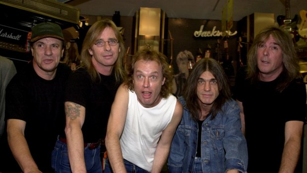 We won't see this ever again. Cliff Williams, far right, is the latest member of AC/DC to announce retirement. Angus Young, centre, will be the last man standing.