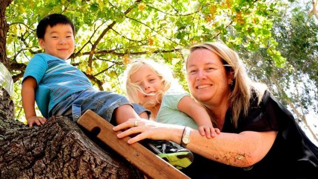 Pet Boles and some of her kindergarten kids Gabriel (left) and Madison, both four years-old at the Minifie Park Early Childcare Centre.