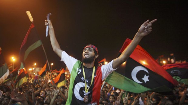 Libyans celebrate the capture in Tripoli of Muammar Gaddafi's son and one-time heir apparent, Seif al-Islam, at the rebel-held town of Benghazi. Libyan rebels raced into Tripoli in a lightning advance that met little resistance. The euphoric fighters celebrated with residents of the capital in the city's main square, the symbolic heart of the regime.