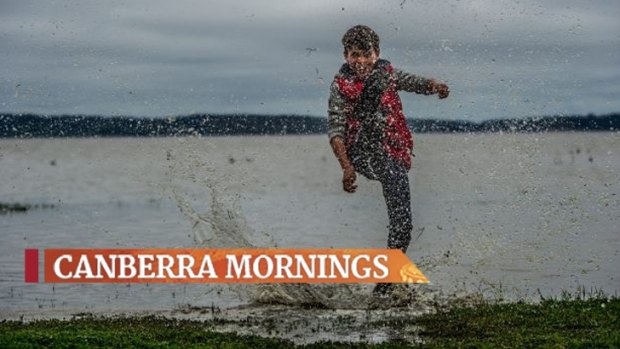 Tom Osborne, 11, splashes around in Lake George.