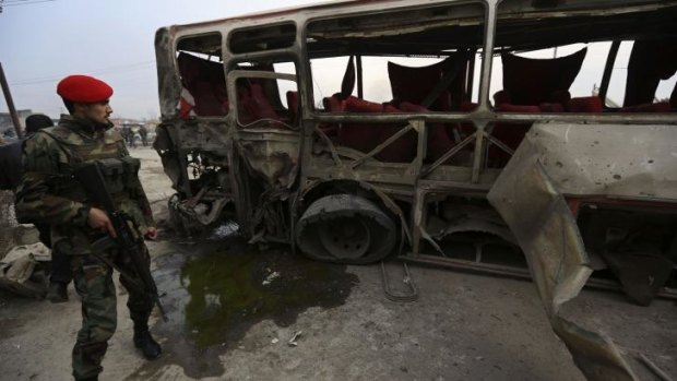 Explosion: The wreckage of the bus hit by the suicide attack in Kabul.