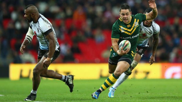 Jarryd Hayne bursts past Marika Koroibete on his way to scoring a try at the weekend.