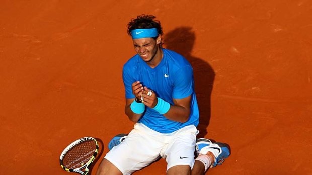 Giving thanks: An emotional Rafael Nadal rejoices after his four-set win over Roger Federer.