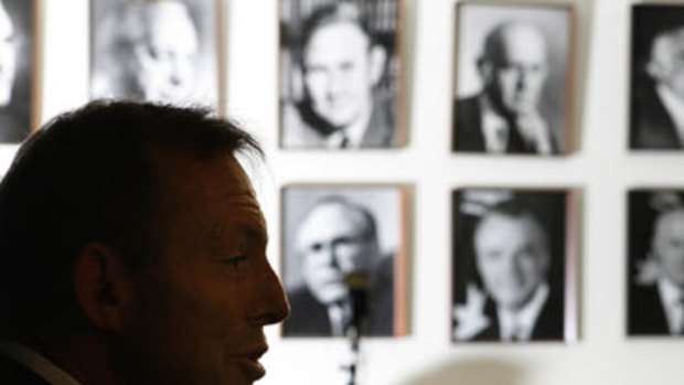 Profile of a new leader ... Tony Abbott, addressing the media in the Liberal party room at Parliament House yesterday, where his portrait will soon hang beside that of Malcolm Turnbull