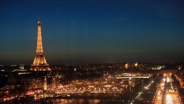 The Eiffel Tower is seen illuminated during nightfall, in Paris, Tuesday, Jan. 12, 2016. (AP Photo/Thibault Camus)