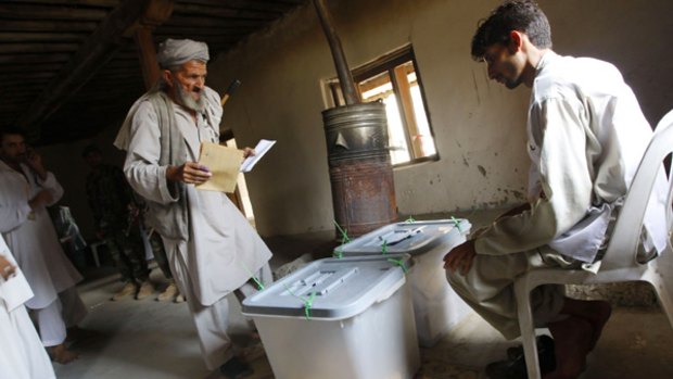 An Afghan man votes at a mosque in Kunar province.