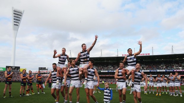 GEELONG, AUSTRALIA - SEPTEMBER 05:  James Kelly (L) is carried off by Jimmy Bartel and Harry Taylor, Steve Johnson of the Cats (C) by Tom Lonergan (L) and Andrew Mackie and Mathew Stokes is carried off by Corey Enright and Joel Selwood (R) after playing their last game for the club during the round 23 AFL match between the Geelong Cats and the Adelaide Crows at Simonds Stadium on September 5, 2015 in Geelong, Australia.  (Photo by Michael Dodge/Getty Images)