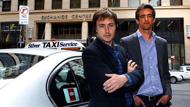 Andrew Campbell, left, and Ned Moorfield  of goCatch with a  cab outside their office in  Sydney.