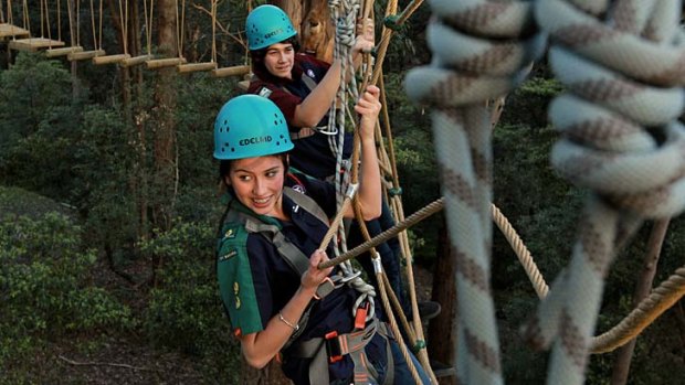Tiptoe through the treetops &#8230; Olivia Kesteven and Angus Simpson do the high ropes course at the Baden-Powell Scout Centre, Pennant Hills.