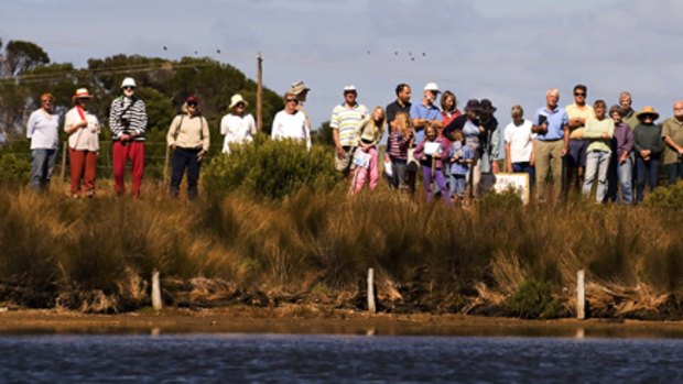 Members of community group Coastal Spaces gather near Point Lonsdale at the wetlands near the proposed site of a $390 million development.