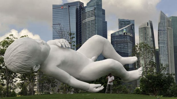 This giant sculpture of a baby, titled<i> Planet</i> by British artist Marc Quinn, featured at Gardens by the Bay, epitomises the Singaporean government's dependence on future generations for economic growth.