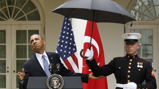 Heavy weather: Barack Obama faced questions over three bad news stories for his administration.