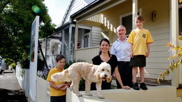 Joining the auction rush: Rob Large and Nicky Bennett, with children Reilly, 11, and Presley, 8, are selling their Balmain home on Saturday.