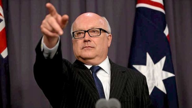 Attorney-General Senator George Brandis addresses a Canberra media conference on Wednesday..