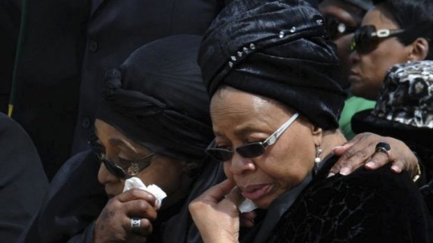 Graca Machel (right) with Mandela's first wife, Winnie, at the anti-apartheid leader's ancestral home Qunu on the day of his funeral in December.