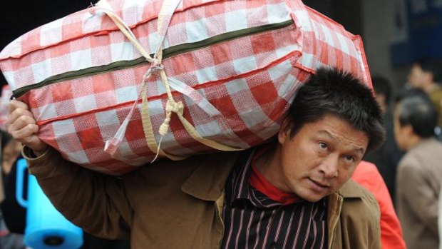 A migrant labourer returns to his home in Hefei. About 54 per cent of the population lives long-term in towns and cities, but only 36 per cent are counted as urban under registration rules.