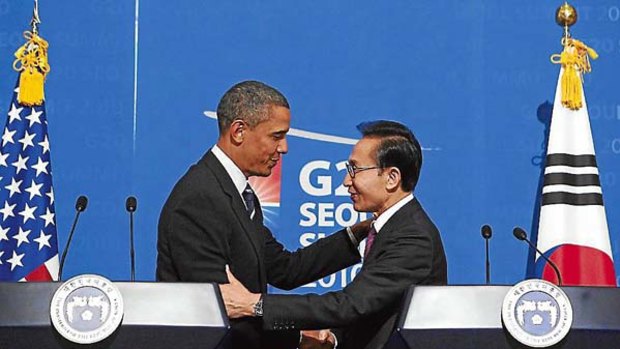 Shake on it ... Barack Obama with the South Korean President, Lee Myung-bak, at a joint news conference in Seoul.