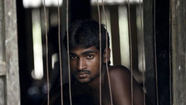 A refugee from Bangladesh, who was rescued by the Myanmar navy, at a Muslim religious school used as a temporary refugee camp in Myanmar.