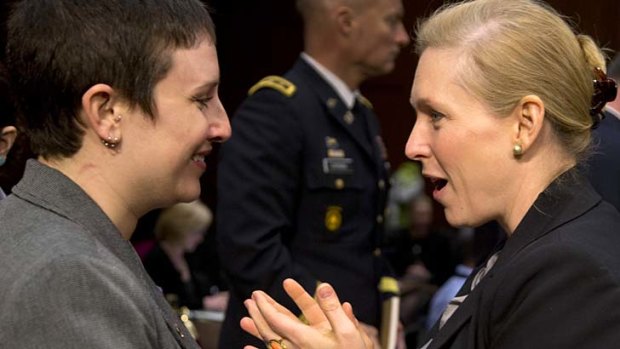 Senator Kirsten Gillibrand (right) speaks to former Army sergeant Rebekah Havrilla at Wednesday's hearings into sexual abuse in the military.