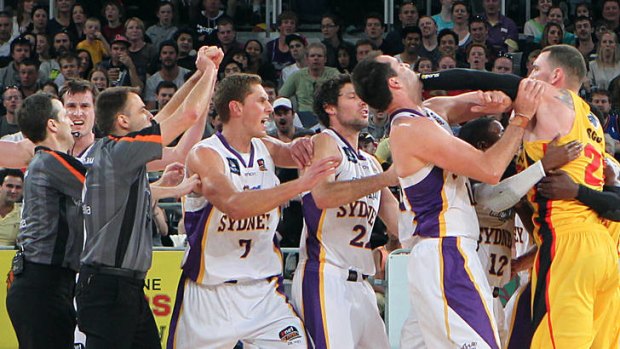 Tigers import Seth Scott tangles with Kings centre Ian Crosswhite at Hisense Arena during their spiteful NBL clash on Sunday.