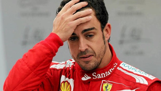 Not happy ... Fernando Alonso of Spain.