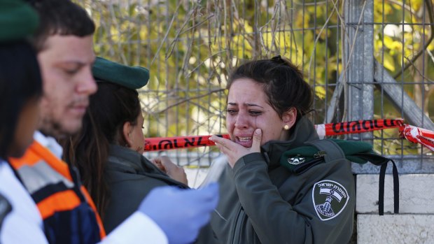 An Israeli border police officer at the scene of the attack.