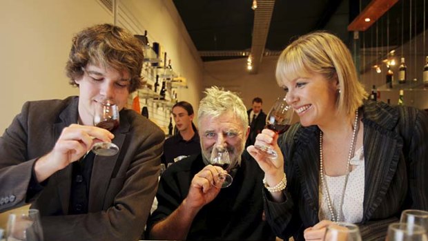 Masters of Wine lecturer Rob Geddes (centre), tasting with students.