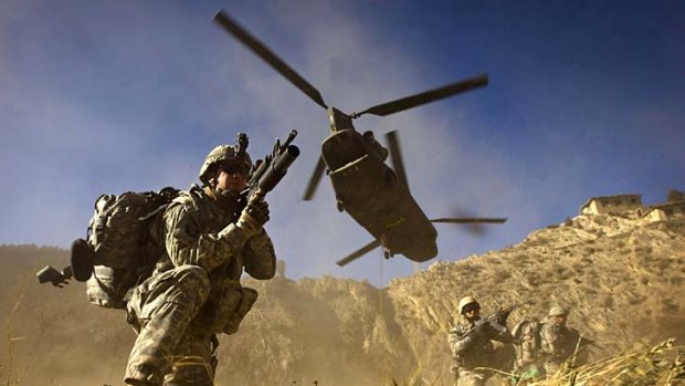 Filephoto shows US Army soldiers and Afghan National Army soldiers taking positions after racing off the back of a UH-47 Chinook helicopter, similar to the craft that crashed and killed 31 US soldiers yesterday..