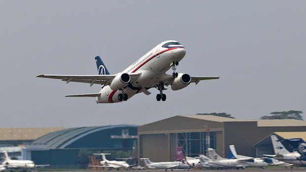 In this photo released by Sergey Dolya, a Sukhoi Superjet-100 takes off from Halim Perdanakusuma airport in Jakarta.