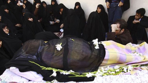 Sidelined and defrocked ... family and friends surround the body of Grand Ayatollah Hossein Ali Montazeri at his home in Qom, 125 kilometres south of Tehran.