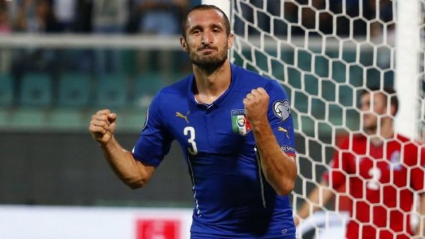 Redemption: Giorgio Chiellini celebrates his third goal of Italy's 2-1 win.