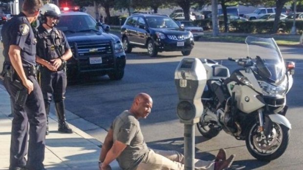 Beverly Hills police handcuffed and arrested producer Charles Belk after he 'fit the description' of a bank robber.