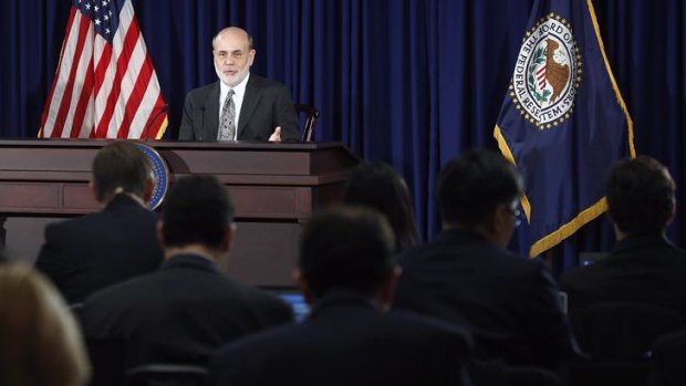 US Federal Reserve chairman Ben Bernanke responds to reporters during his final planned news conference before his retirement.