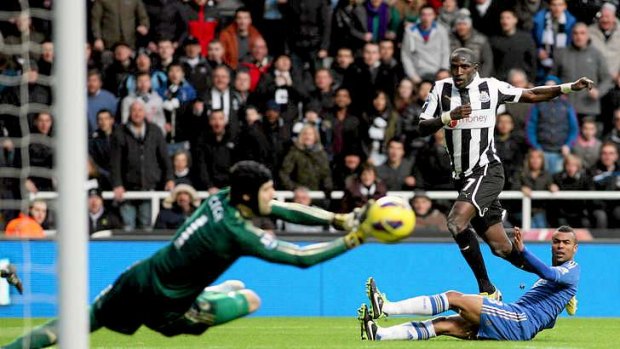Moussa Sissoko of Newcastle United has his shot saved by Chelsea's goalkeeper Petr Cech.