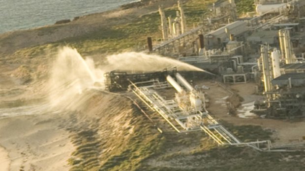 An aerial view of water cannons spraying an area ripped by an explosion at a gas plant located on Varanus Island, about 100km off Karratha.