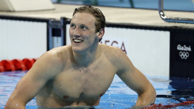 Winner: Australia's Mack Horton smiles after taking out gold in the final of the men's 400m freestyle.