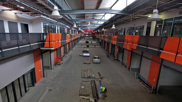 Work continues inside Melbourne's relocated wholesale fruit and vegetable market in Epping.