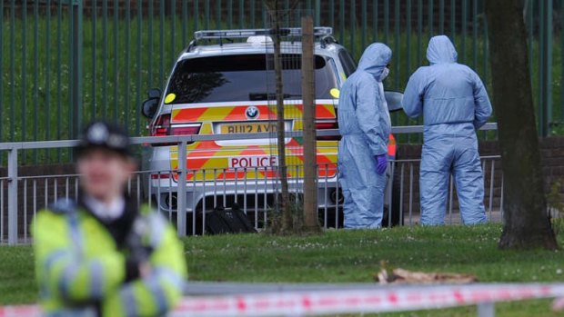 British police shot and wounded two men after a man thought to be a serving soldier was killed outside a London barracks.