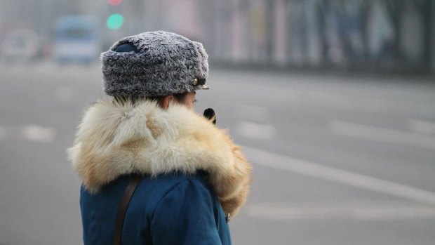 A traffic policewoman in the street near Kim Il-sung Square.