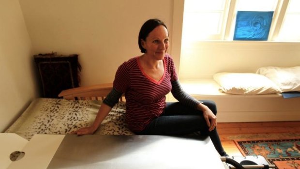 Victoria Spence prepares a cooling bed designed to keep a body cold while families mourn in their own homes. 