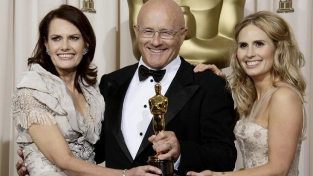 Heath Ledger's mother Sally Bell, father Kim Ledger, and sister Kate Ledger hold Heath's Oscar from 2009.